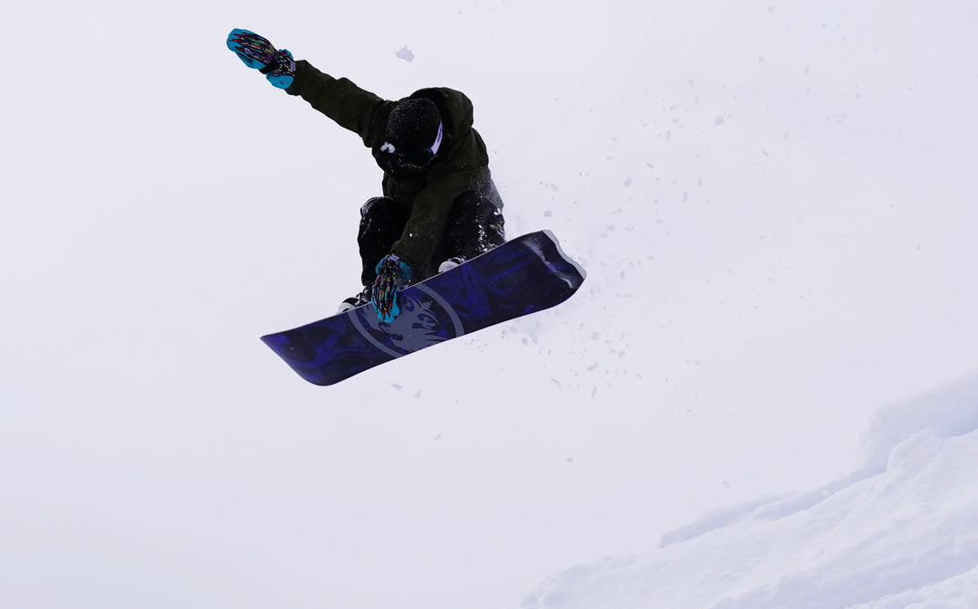 Skyler Gallardo airing on V-Twin Snowboard